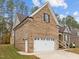 Brick home with attached two-car garage at 184 Dereham Ln, Garner, NC 27529