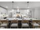 Modern kitchen island featuring a white marble countertop and seating, perfect for entertaining at 184 Dereham Ln, Garner, NC 27529