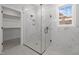 Spacious walk-in shower with marble tile and glass enclosure at 184 Dereham Ln, Garner, NC 27529