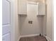 Laundry area with upper cabinets and space for washer and dryer at 360 Sandy Ridge Rd, Dunn, NC 28334