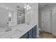 Double vanity bathroom with blue cabinets and white countertops at 38 Locomotive Way, Clayton, NC 27520