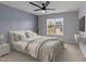 Bedroom with light-colored walls, a queen bed, and a ceiling fan at 38 Locomotive Way, Clayton, NC 27520