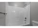 Bright, clean bathroom with a streamlined tub and shower combo at 5600 Thornburg Dr, Wake Forest, NC 27587