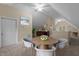 Bright bonus room with a wet bar, table and chairs at 5600 Thornburg Dr, Wake Forest, NC 27587