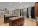 Open kitchen and dining area with granite countertops, a center island, and a view of the backyard at 5600 Thornburg Dr, Wake Forest, NC 27587