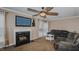 Living room with fireplace, TV, and seating at 208 Mallard Creek Dr # B, Graham, NC 27253