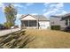 View of the backyard with a screened porch and well-maintained lawn at 219 Rosedale Creek Dr, Durham, NC 27703