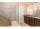 Clean bathroom with walk in shower and granite countertop vanity offering a luxurious experience at 219 Rosedale Creek Dr, Durham, NC 27703