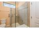 Modern bathroom featuring a tiled shower with glass door and convenient grab bars at 219 Rosedale Creek Dr, Durham, NC 27703