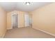 Cozy bedroom with neutral walls and carpet, featuring two doors for easy access at 219 Rosedale Creek Dr, Durham, NC 27703
