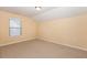 Bright bedroom with neutral carpet and a sunny window, ideal for relaxation at 219 Rosedale Creek Dr, Durham, NC 27703