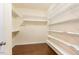 Spacious walk-in closet with wooden floors and wire shelving perfect for organization at 219 Rosedale Creek Dr, Durham, NC 27703