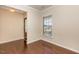 Inviting dining room with hardwood floors and natural light from the window at 219 Rosedale Creek Dr, Durham, NC 27703