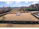 Large dog park with shade structure, agility equipment, and fenced area at 219 Rosedale Creek Dr, Durham, NC 27703