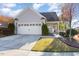 Charming single-story home with a well-manicured lawn, two car garage, and inviting entrance at 219 Rosedale Creek Dr, Durham, NC 27703