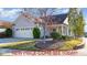 Charming home featuring a two-car garage, manicured landscaping, and mature trees in a desirable neighborhood at 219 Rosedale Creek Dr, Durham, NC 27703