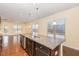 Stylish kitchen island with granite countertops and stainless steel dishwasher, ideal for meal preparation at 219 Rosedale Creek Dr, Durham, NC 27703