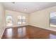 Inviting living room with natural light and hardwood floors offers a warm and spacious area at 219 Rosedale Creek Dr, Durham, NC 27703