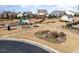 Community playground with swings, benches, and picnic tables at 219 Rosedale Creek Dr, Durham, NC 27703