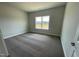 Bright bedroom featuring carpeted floors and a window at 37 Streamline Ct, Lillington, NC 27546