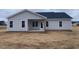 New home with covered patio and grassy backyard at 5890 Old Smithfield Rd, Spring Hope, NC 27882