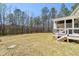 A large grassy backyard offers ample space for outdoor activities and landscaping opportunities at 617 Darian Woods Dr, Holly Springs, NC 27540