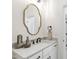 Bathroom vanity with gold mirror, decorative vases, light countertop and dark fixtures at 617 Darian Woods Dr, Holly Springs, NC 27540