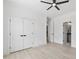 Bedroom with hardwood style floors, double closets, and neutral paint at 617 Darian Woods Dr, Holly Springs, NC 27540