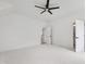 Spacious bedroom with a ceiling fan, and multiple doors with black hardware that add a modern touch at 617 Darian Woods Dr, Holly Springs, NC 27540