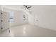 This bedroom boasts natural light, a ceiling fan, and features an entrance to a walk in closet at 617 Darian Woods Dr, Holly Springs, NC 27540