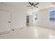 The bedroom boasts natural light, a ceiling fan, and a doorway to an en suite bathroom at 617 Darian Woods Dr, Holly Springs, NC 27540