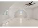 Bright bedroom with vaulted ceilings, ceiling fan, and multiple windows at 617 Darian Woods Dr, Holly Springs, NC 27540