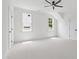 Bright bedroom features a ceiling fan, neutral carpet, and multiple windows for natural light at 617 Darian Woods Dr, Holly Springs, NC 27540