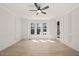 Bright bedroom featuring detailed trim work, a modern fan, and natural lighting at 617 Darian Woods Dr, Holly Springs, NC 27540