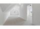 Large bonus room with plush carpet, neutral walls, and ample natural light at 617 Darian Woods Dr, Holly Springs, NC 27540