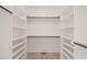Spacious walk-in closet with custom shelving and ample storage space at 617 Darian Woods Dr, Holly Springs, NC 27540