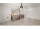 Bright hallway with wood floors and French doors leading to outdoor area at 617 Darian Woods Dr, Holly Springs, NC 27540