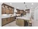 Spacious kitchen with stainless appliances, ample cabinet space, a large island, and barstool seating at 617 Darian Woods Dr, Holly Springs, NC 27540