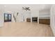Open living room showcases a fireplace, staircase, and a dark wood front door at 617 Darian Woods Dr, Holly Springs, NC 27540