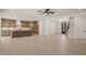 Spacious open floor plan combines the kitchen with island, living area, and entry way at 617 Darian Woods Dr, Holly Springs, NC 27540