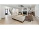 Cozy living room with fireplace, built-in shelves, hardwood floors, and comfortable seating at 617 Darian Woods Dr, Holly Springs, NC 27540