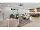 Spacious open-concept living area with hardwood flooring, fireplace, and connection to the kitchen at 617 Darian Woods Dr, Holly Springs, NC 27540
