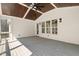 Relaxing screened porch featuring a vaulted ceiling, ceiling fan, and ample space to unwind at 617 Darian Woods Dr, Holly Springs, NC 27540