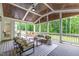 Spacious screened porch featuring comfortable seating and views of the private backyard at 617 Darian Woods Dr, Holly Springs, NC 27540