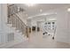 Modern staircase with metal balusters and light wood treads at 617 Darian Woods Dr, Holly Springs, NC 27540