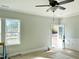 Bright and spacious living room with neutral walls and a view of the backyard at 6644 Sheriff Watson Rd, Sanford, NC 27332