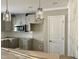 Modern kitchen with gray cabinets and an island at 6648 Sheriff Watson Rd, Sanford, NC 27332