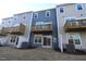 Townhome backyard featuring balconies, sliding glass doors, and modern architecture at 2325 Bay Minette Sta # 548, Apex, NC 27502