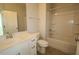 Bright bathroom featuring a single sink, white cabinets, and a shower-tub combo at 2325 Bay Minette Sta # 548, Apex, NC 27502