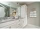 Elegant bathroom with a double sink vanity, granite countertop, and decorative coastal accessories at 2325 Bay Minette Sta # 548, Apex, NC 27502